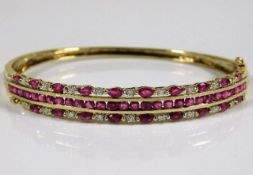 A 9ct gold bangle set with diamond & ruby approx.