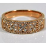 A French 18ct pink gold ring profusely set with di