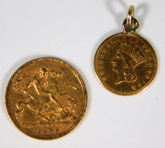 A Victorian half gold sovereign dated 1897 twinned