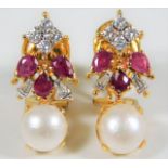 A pair of 18ct gold (tested) earrings set with diamonds, Burma ruby & pearl