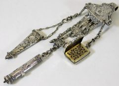 A 19thC. white metal chatelaine which includes an