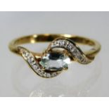 A 9ct gold topaz & diamond ring 2.1g size N