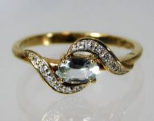 A 9ct gold topaz & diamond ring 2.1g size N