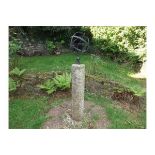 A granite mounted with an armillary sphere approx.