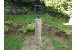 A granite mounted with an armillary sphere approx.