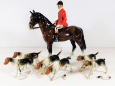 A Beswick style huntsman & hounds, small chip to base of hoof of horse, two dogs undamaged & other f