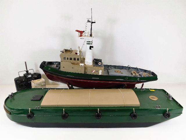 A radio control model Burutu tug with barge & cont
