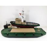 A radio control model Burutu tug with barge & cont