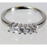 An 18ct gold ring set with five princess cut diamo