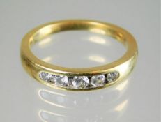 An 18ct gold ring set with diamonds 4g size M/N