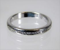 An 18ct gold half eternity ring set with diamonds