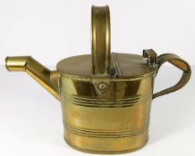 A brass watering can after Christopher Dresser 12i