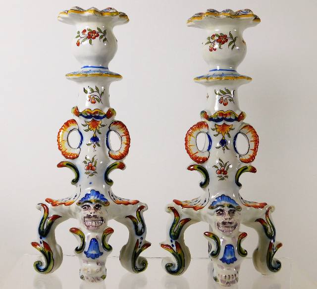 A pair of Rouen faience candlesticks with masked t