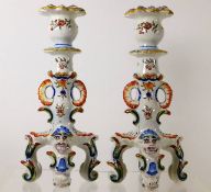 A pair of Rouen faience candlesticks with masked t