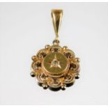 A yellow metal, test as 18ct gold, pendant set wit