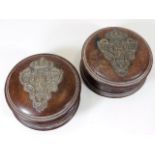 A pair of stained walnut containers with silver cr