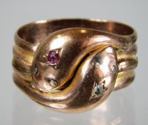 A 9ct rose gold double snake headed ring set with