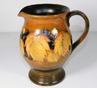 A mid 20thC. Moorcroft pottery leaf & berry jug in autumnal colourway 7in tall