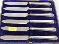 A set of six silver handled fruit knives