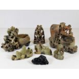 Seven pieces of carved soapstone, one with chips,