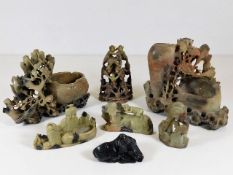 Seven pieces of carved soapstone, one with chips,