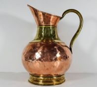 A Victorian copper & brass jug 13in high