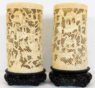 Two large 19thC. finely carved ivory tusks set against reticulated openwork on made to fit carved ha