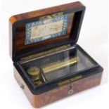A small 19thC. music box, working order, with burr