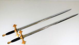 A pair of brass handled Wilkinson swords, each 34i