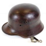 A German WW1 soldiers helmet with chin strap