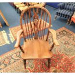 A c.1900 Elm wheelback armchair