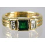 An 18ct gold art deco style emerald ring set with