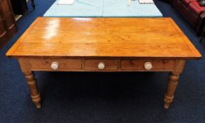 A 19thC. three drawer farmhouse dining table 66.5i
