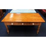 A 19thC. three drawer farmhouse dining table 66.5i