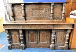 A 17thC. Jacobean style oak sideboard with carving