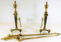 A pair of 19thC. brass fire dogs each 15.75in high