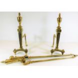 A pair of 19thC. brass fire dogs each 15.75in high