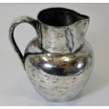 A London 1893 silver water jug with retailer Reid