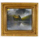 An early 20thC. gilt framed oil of highland loch s