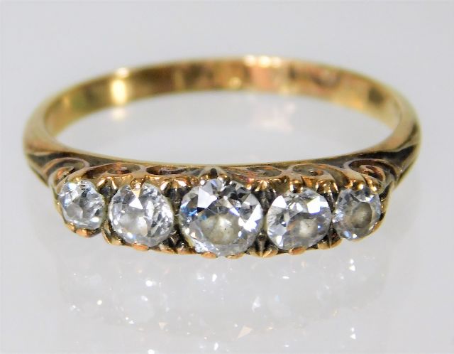 An 18ct gold & diamond five stone ring approx. 0.5