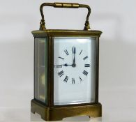 An antique brass carriage clock approx. 5.125in to
