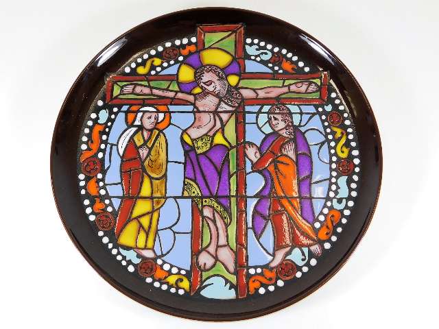 A Poole pottery plate depicting religious stained