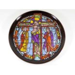 A Poole pottery plate depicting religious stained