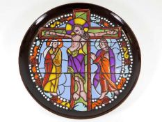 A Poole pottery plate depicting religious stained