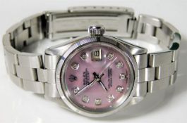 A ladies Rolex Oyster Perpetual Datejust watch with pink mother of pearl dial set with diamonds & bo