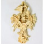 A late 19thC. European carved ivory pendant with o