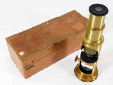 A brass field microscope with box