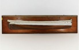 An early 20thC. mounted half hull boat model 36in