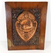 An oak mounted copper plaque inscribed "Made From