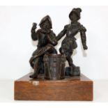 A 19thC. bronze mounted on oak plinth depicting tw